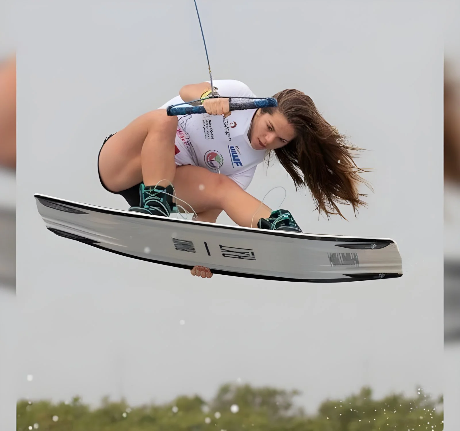Luna Cassart grabbing above the lake