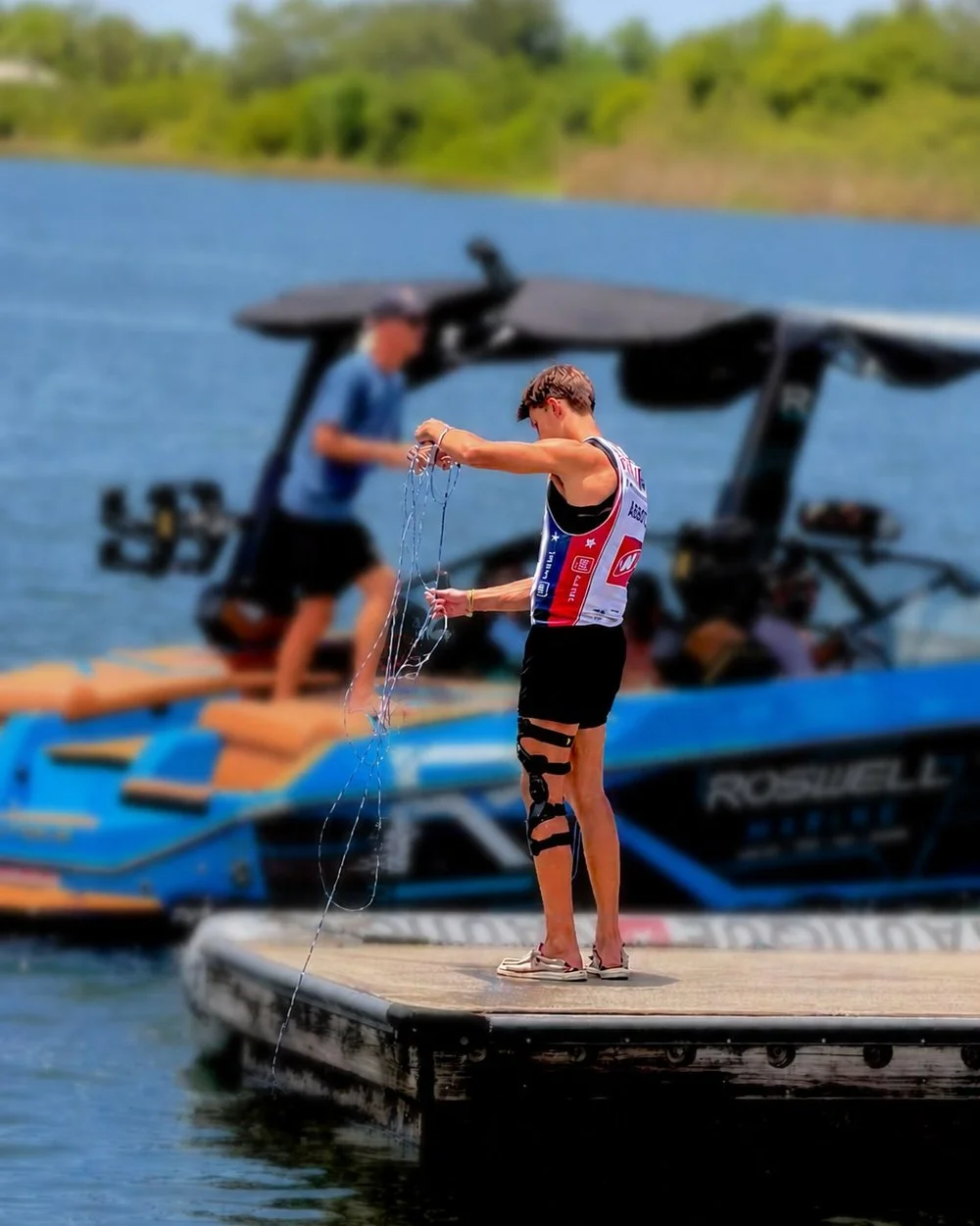 Rex Abbott on the dock in his competition jersey, 2026