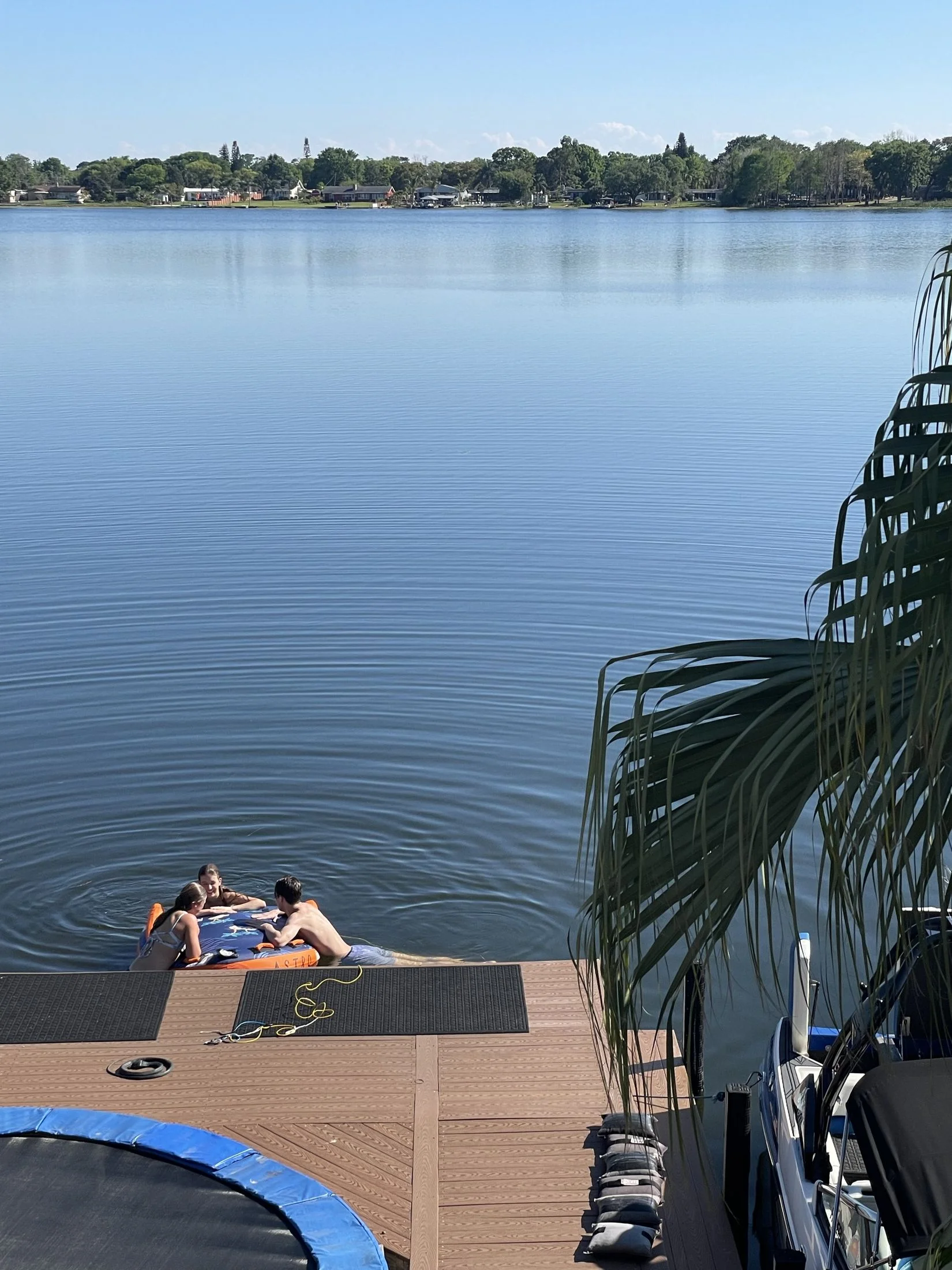 The dock and trampoline on Lake Barton right outside the house